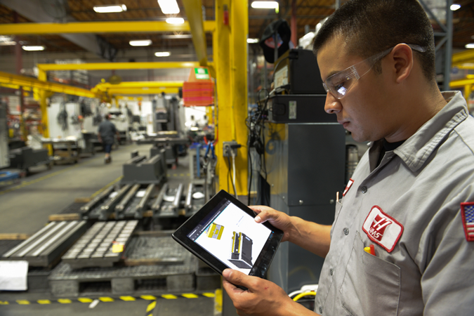 A worker with an iPad.